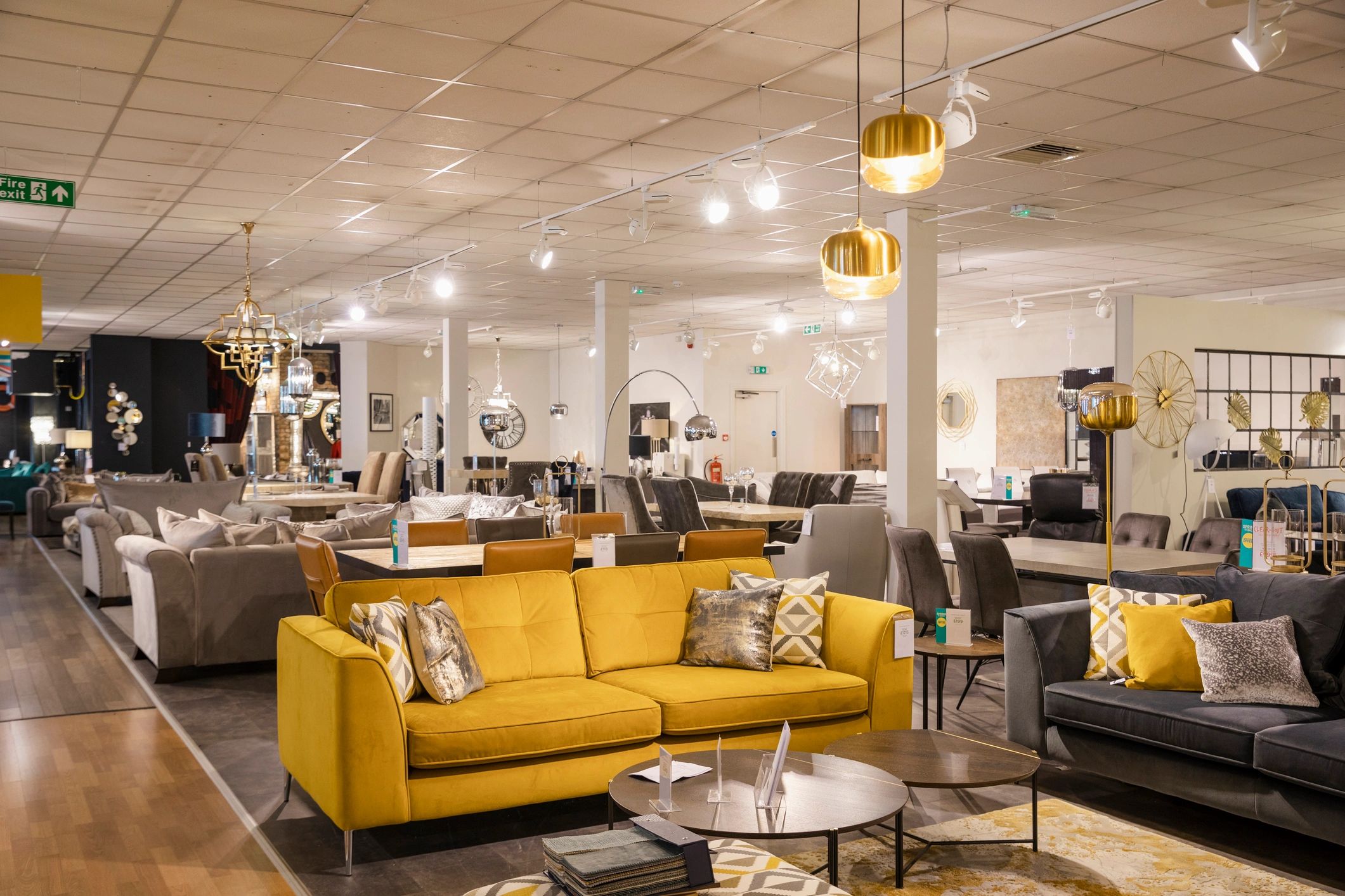 Modern furniture showroom with sofas, lamps, and display pieces